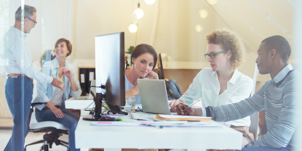 group of coworkers working at desk